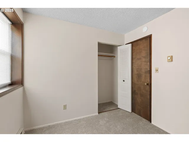 a bathroom with a shower and a toilet