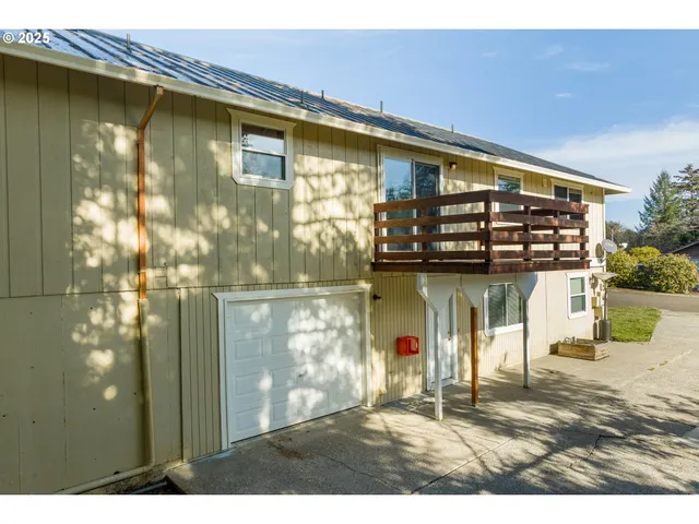 a view of a town with mountains in the background