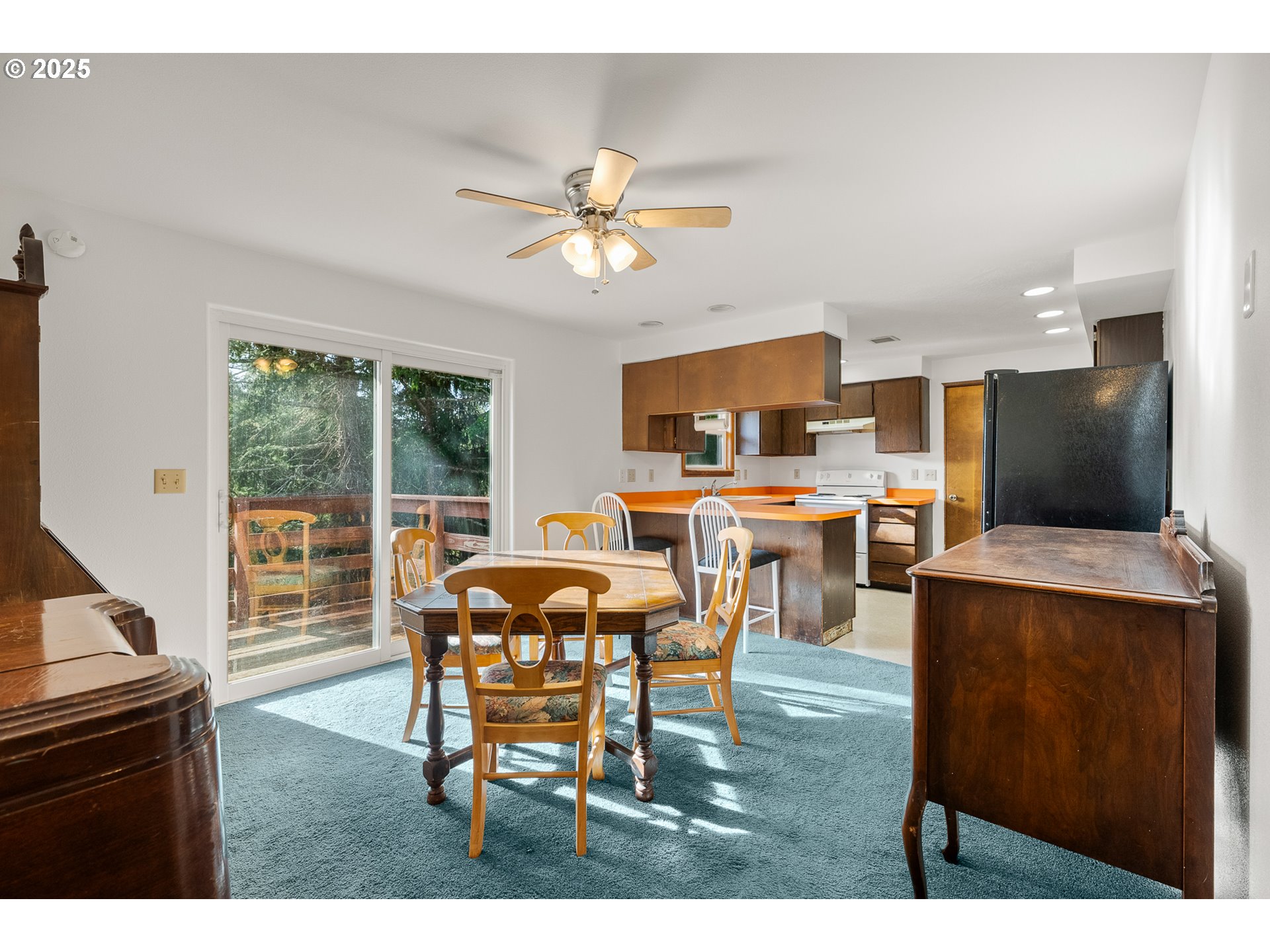 1521 Ranch Road Reedsport, OR 97467 - Photo 8 of 44 a dining room with furniture and a large window