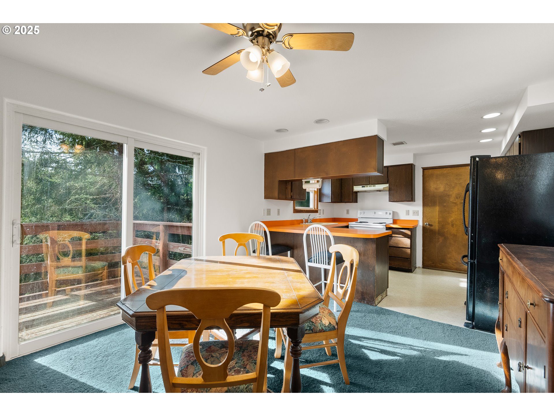 1521 Ranch Road Reedsport, OR 97467 - Photo 9 of 44 a view of a dining room with furniture window and outside view