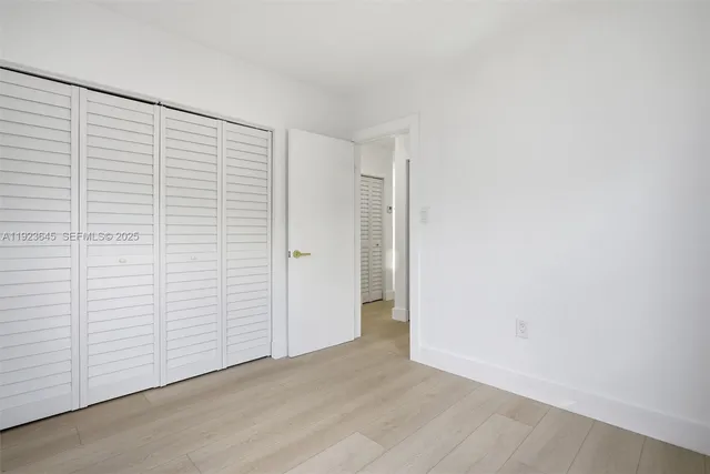 a bathroom with a toilet sink and shower