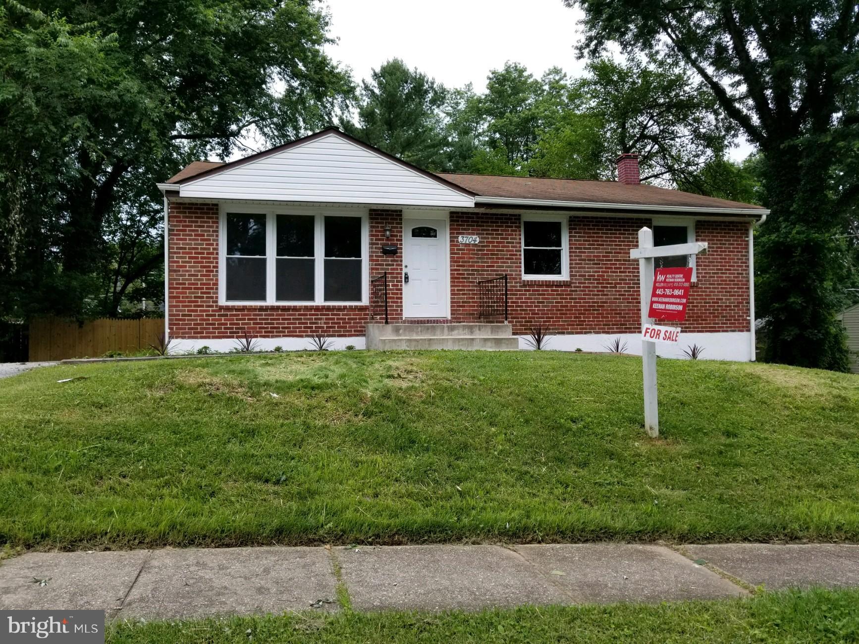 3704 Cassen Road Randallstown, MD 21133 - Photo 3 of 15 a front view of a house with a yard