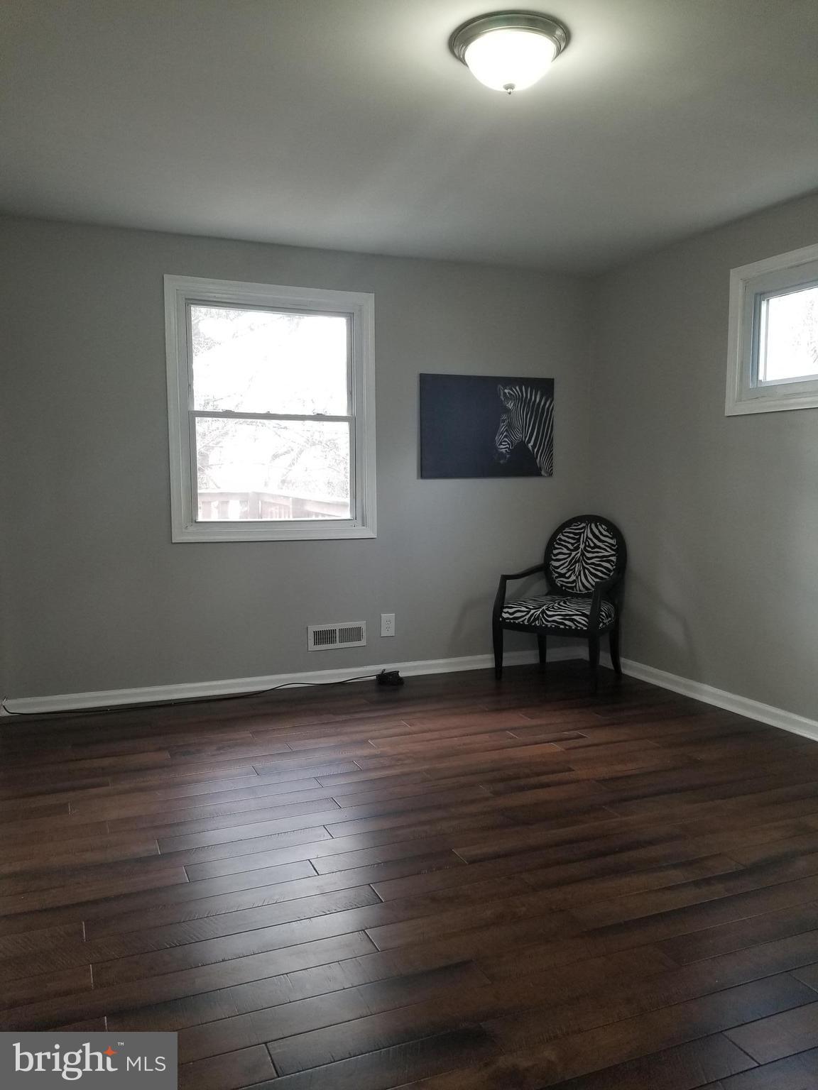 3704 Cassen Road Randallstown, MD 21133 - Photo 9 of 15 a view of a livingroom with wooden floor and a window