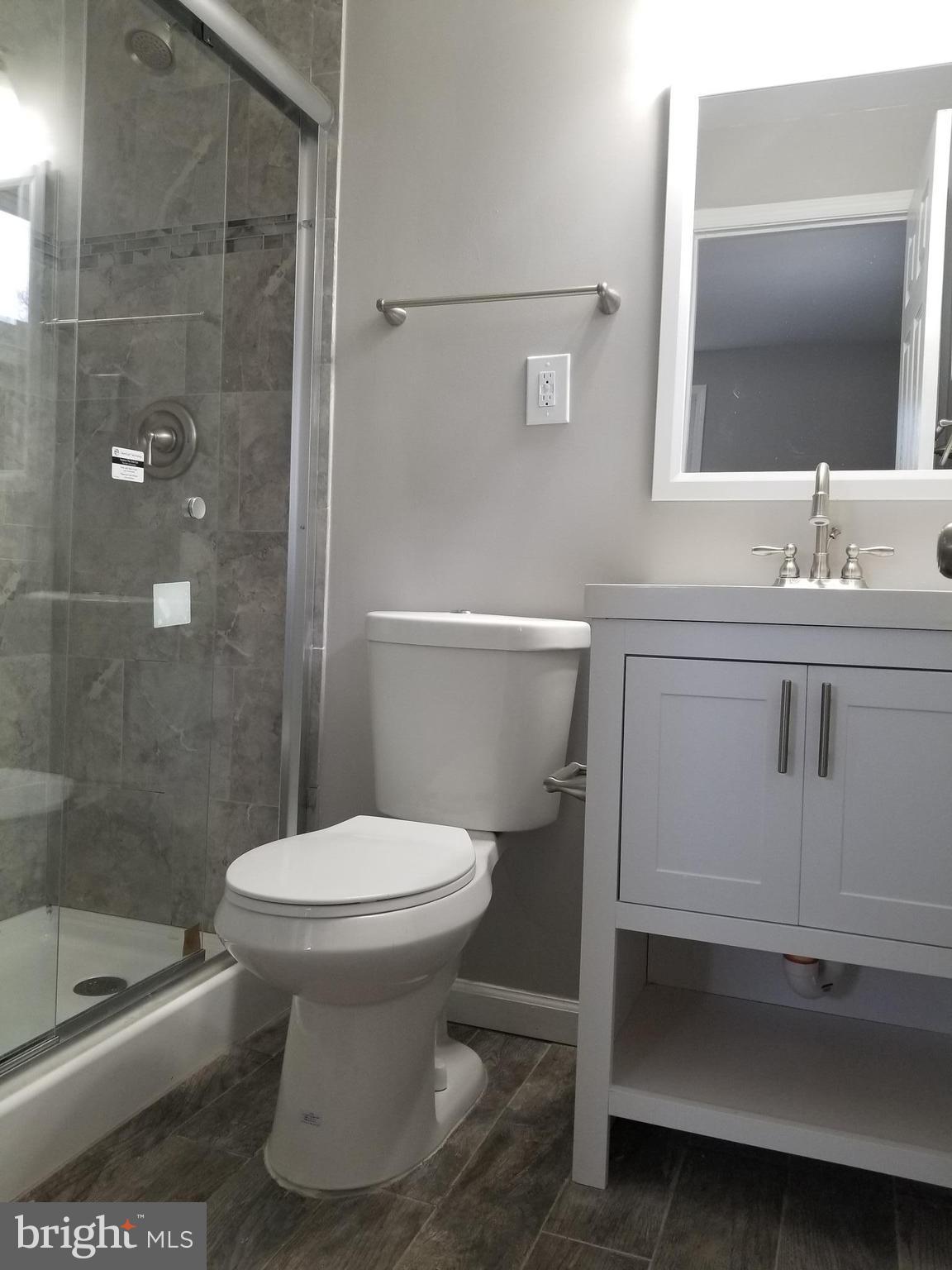 3704 Cassen Road Randallstown, MD 21133 - Photo 10 of 15 a bathroom with a sink toilet and shower