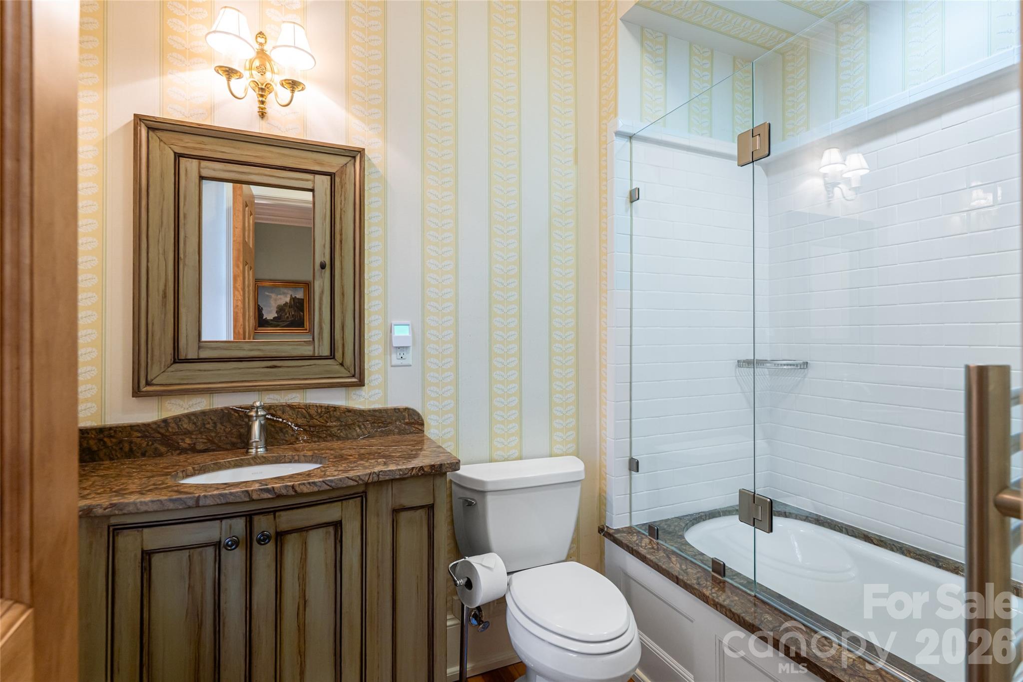 324 Vanderbilt Road Asheville, NC 28803 - Photo 23 of 48 a bathroom with a granite countertop sink toilet and shower