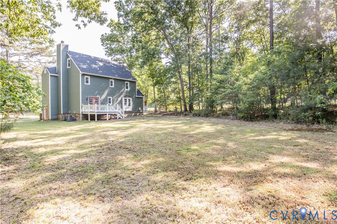 13110 Hensley Road Midlothian, VA 23112 - Photo 3 of 24 a view of a house with a yard and garage