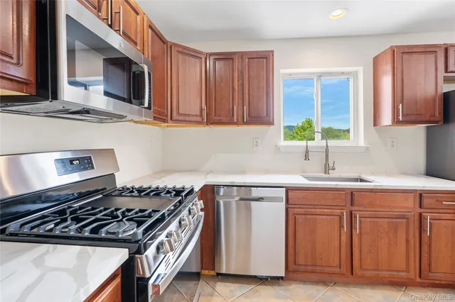 a kitchen with cabinets and appliances