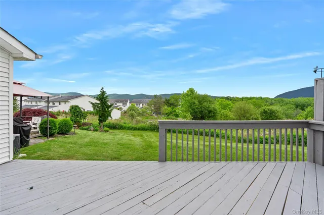 a view of deck with a yard