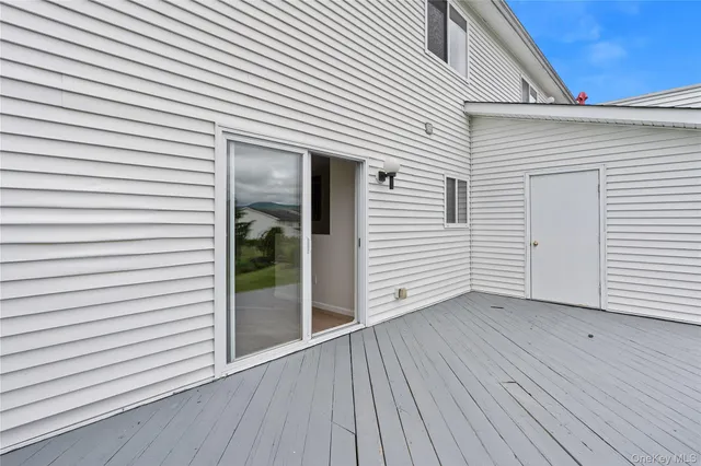 a view of a small space with wooden floor