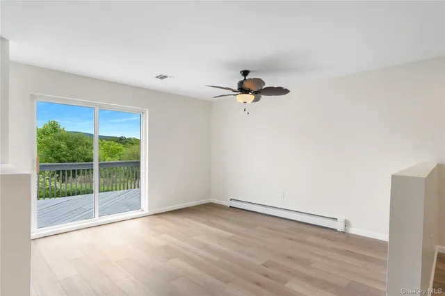a view of a room with a large window
