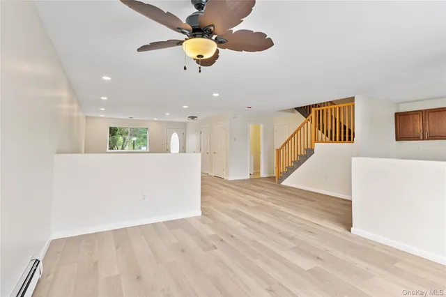 a view of kitchen and hall with wooden floor