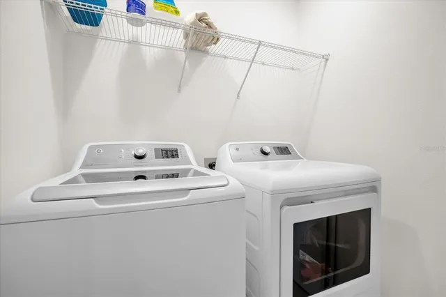 a utility room with dryer and washer