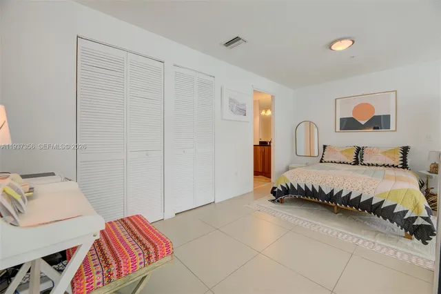 a bedroom with a bed and dresser