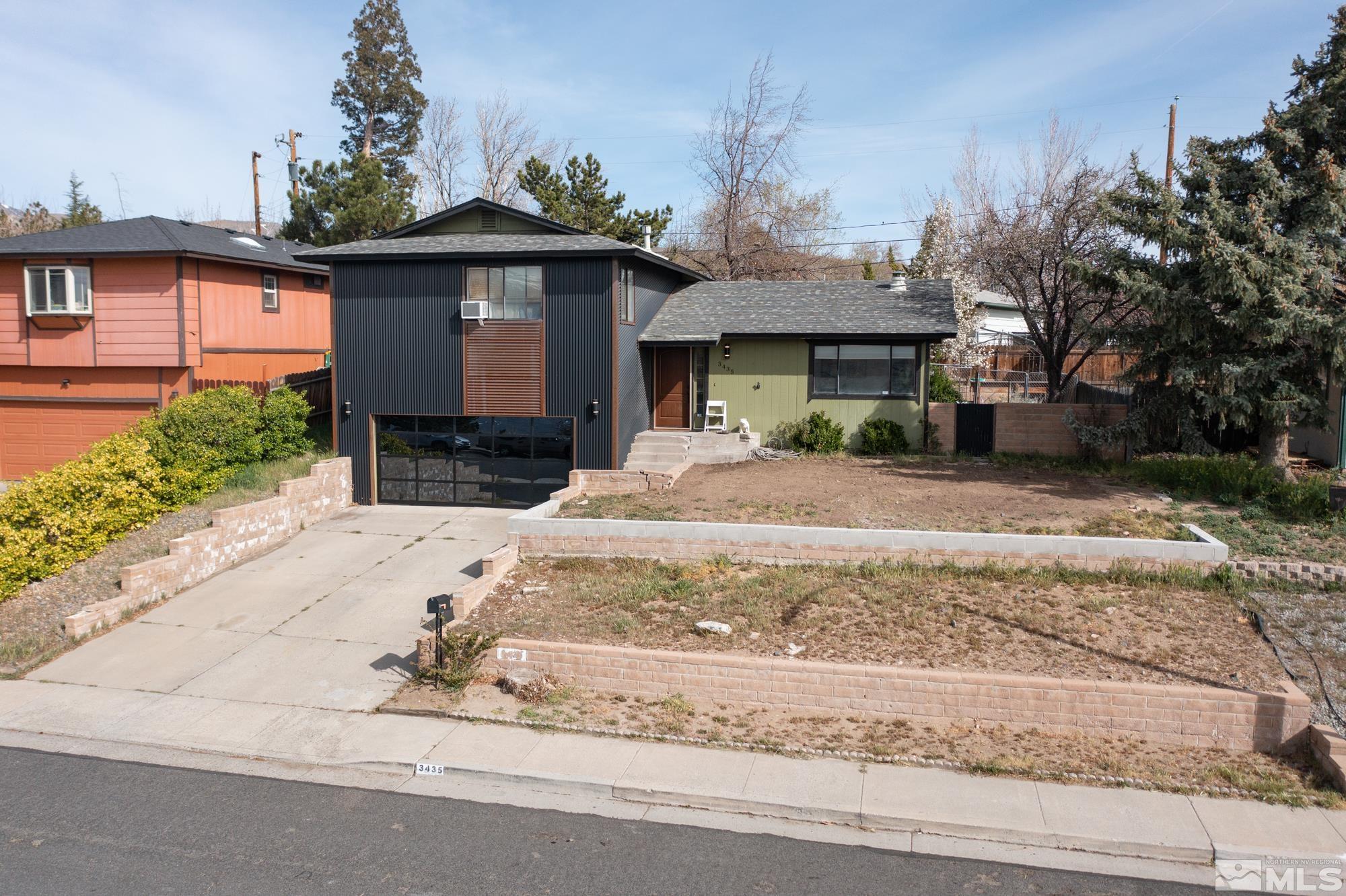 3435 Bowie Road Reno, NV 89503 - Photo 1 of 22 a front view of a house with a yard and garage