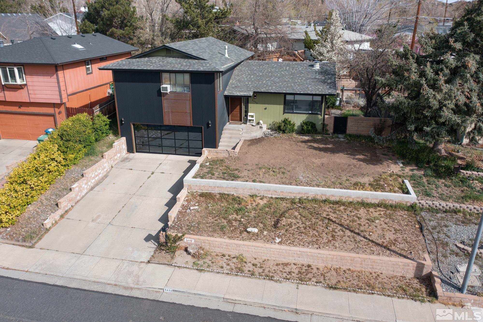 3435 Bowie Road Reno, NV 89503 - Photo 2 of 22 a front view of a house with garden