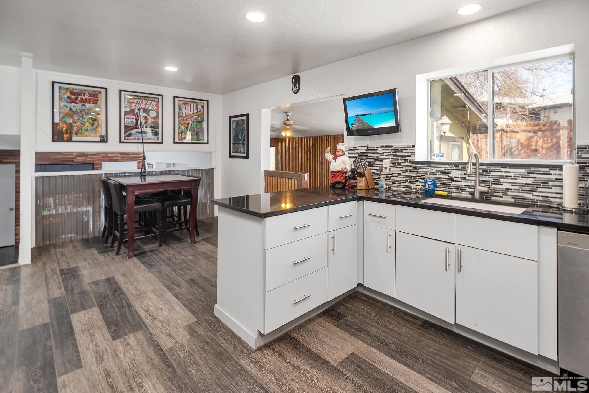 3435 Bowie Road Reno, NV 89503 - Photo 5 of 22 a kitchen with a sink cabinets and wooden floor