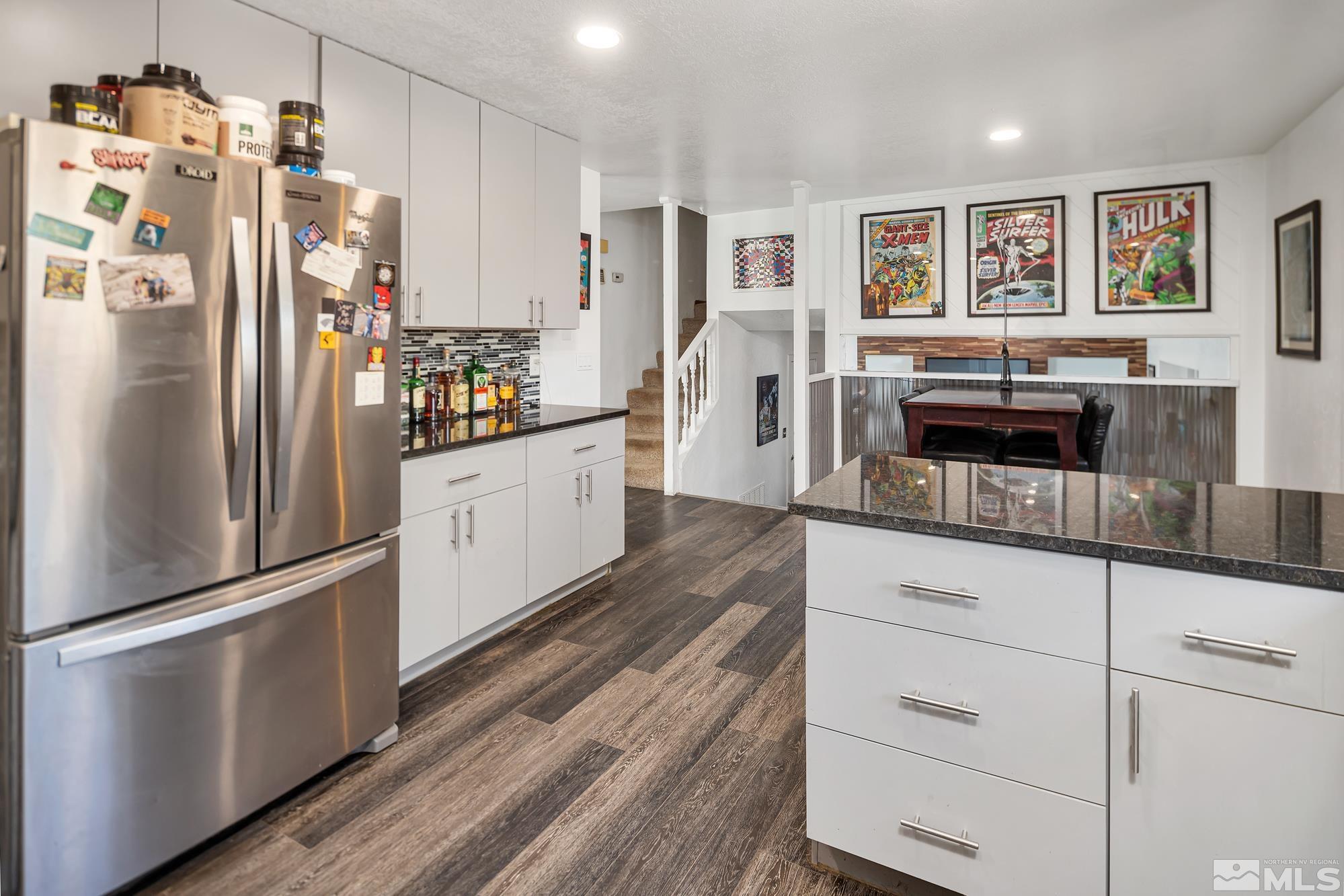 3435 Bowie Road Reno, NV 89503 - Photo 7 of 22 a kitchen with stainless steel appliances a refrigerator and cabinets