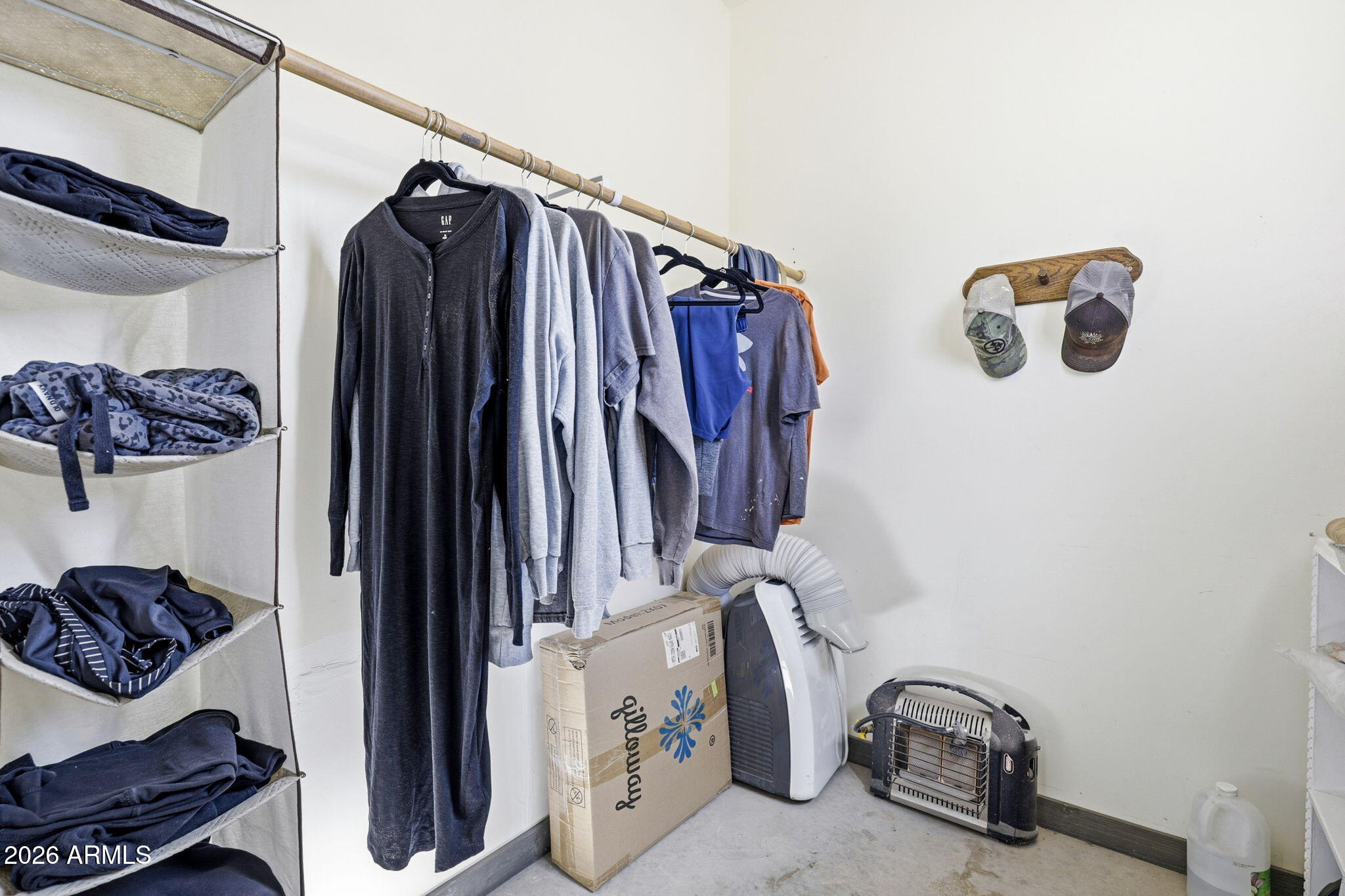77 N8543 Concho, AZ 85924 - Photo 16 of 44 a view of walk in closet with clothes and shoes
