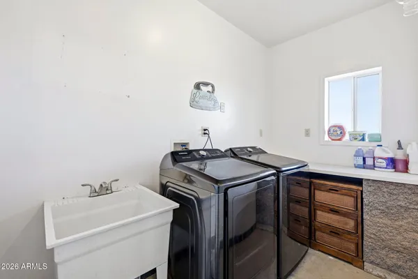 a utility room with dryer and washer