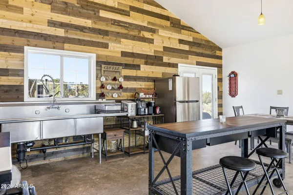 a kitchen with a table and chairs in it