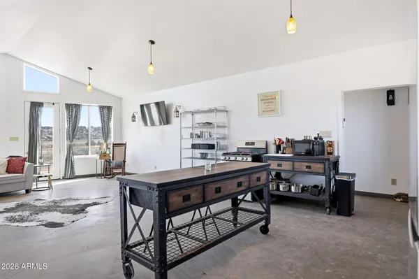 a room with furniture a air conditioner and a window