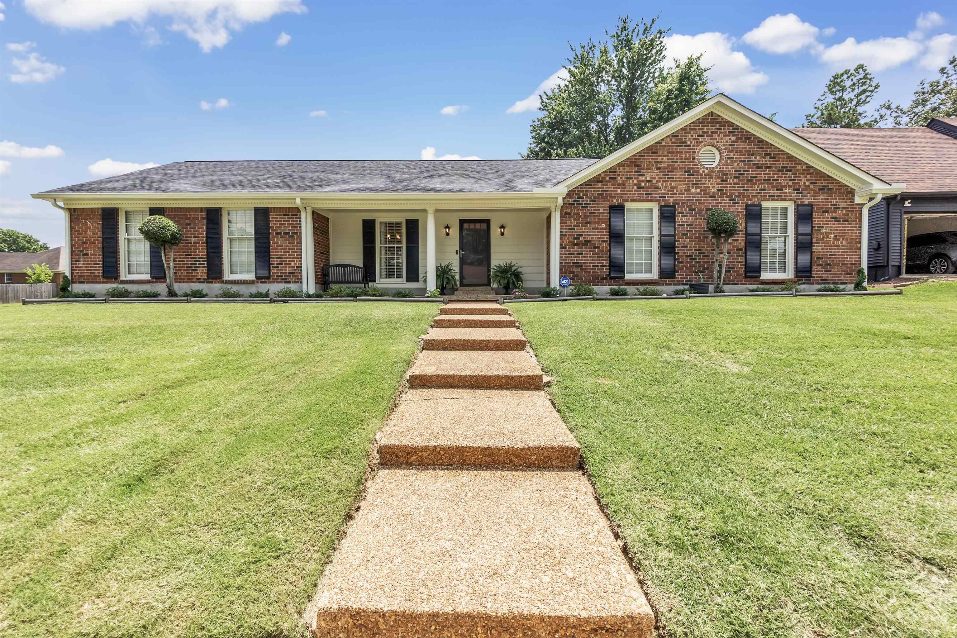 7255 Barnstable Road Memphis, TN 38125 - Photo 1 of 27 Single story home featuring brick siding, a front yard, and roof with shingles