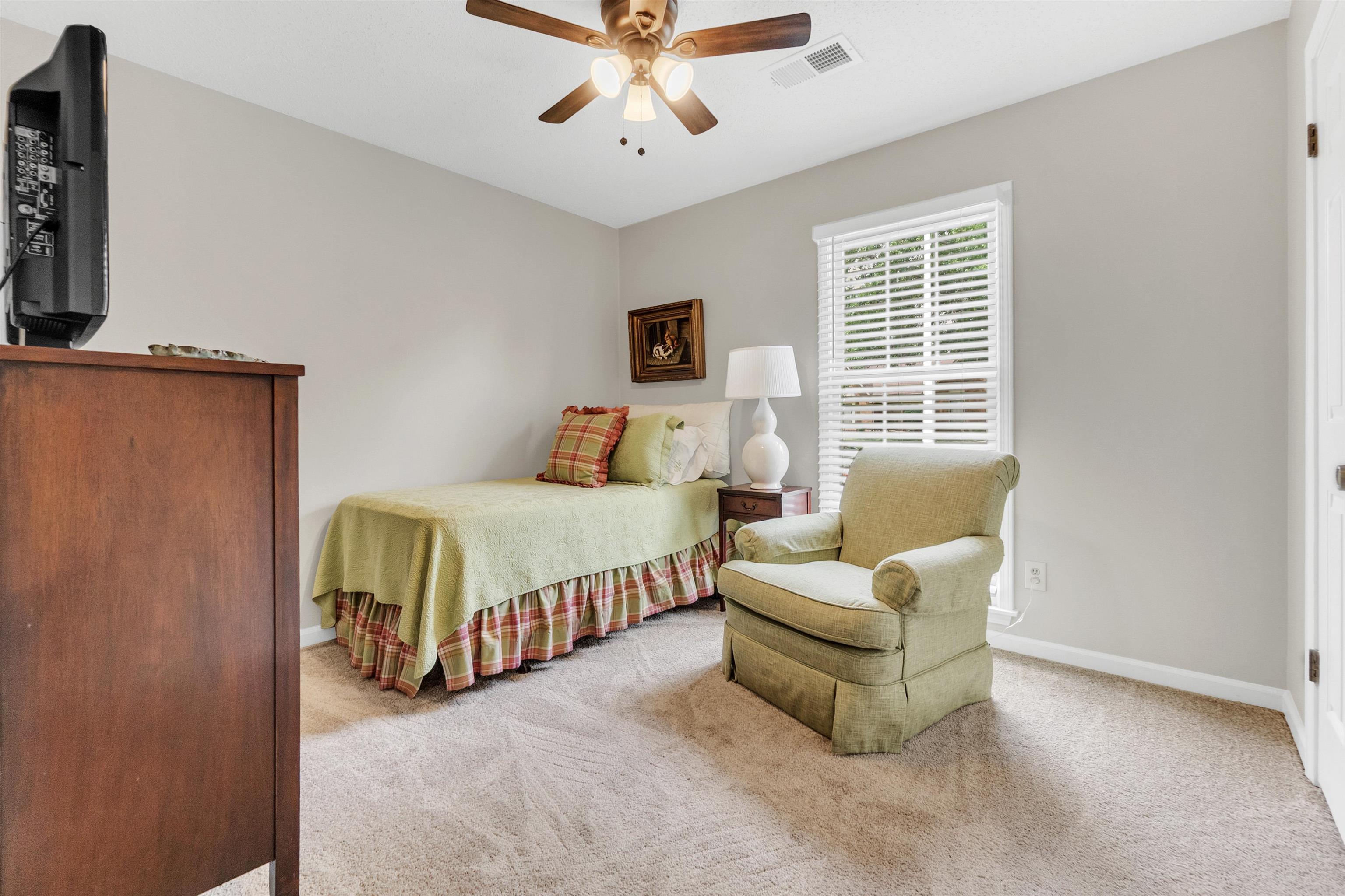 7255 Barnstable Road Memphis, TN 38125 - Photo 19 of 27 Carpeted bedroom featuring baseboards and a ceiling fan