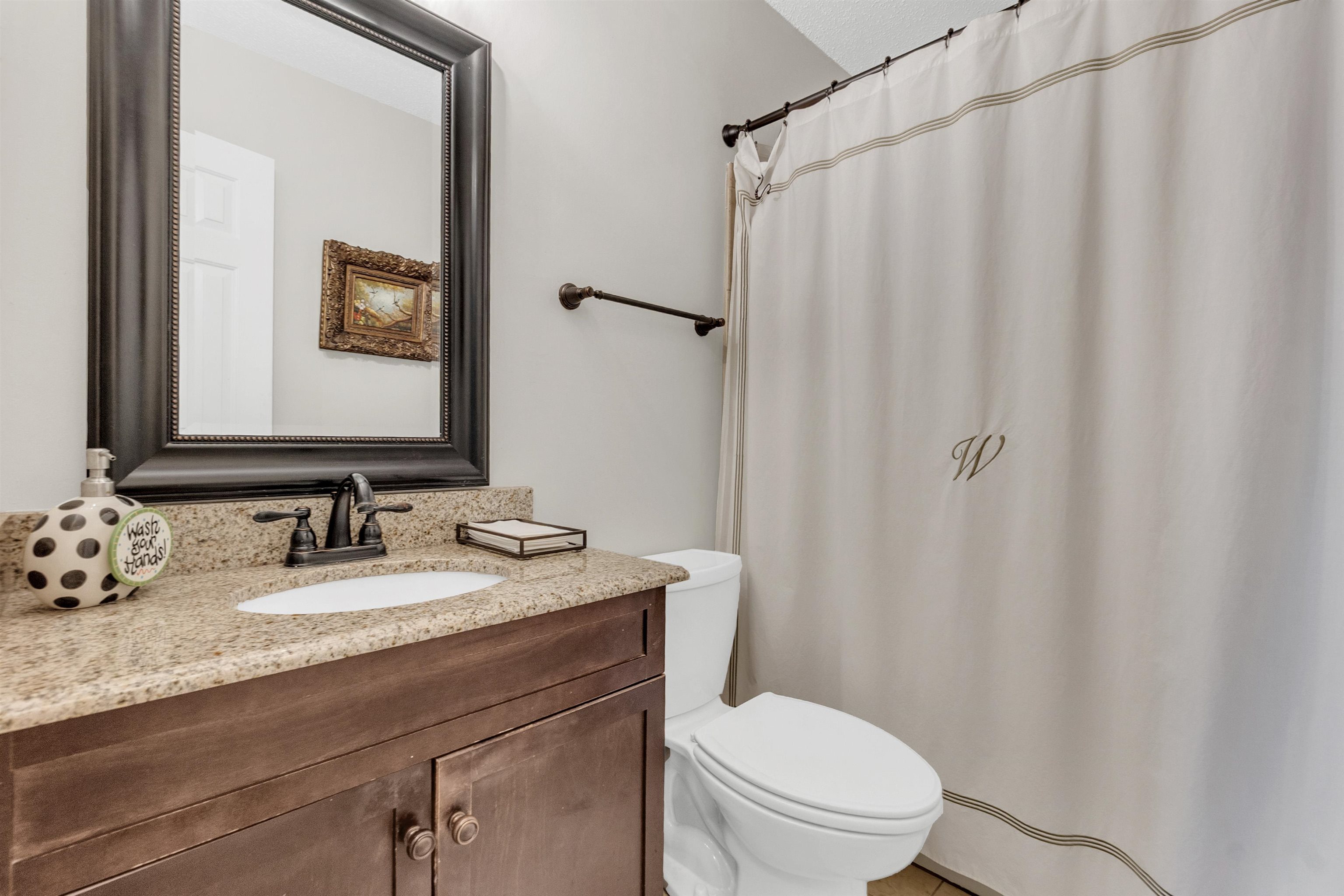 7255 Barnstable Road Memphis, TN 38125 - Photo 21 of 27 Bathroom featuring toilet, vanity, and a shower with curtain