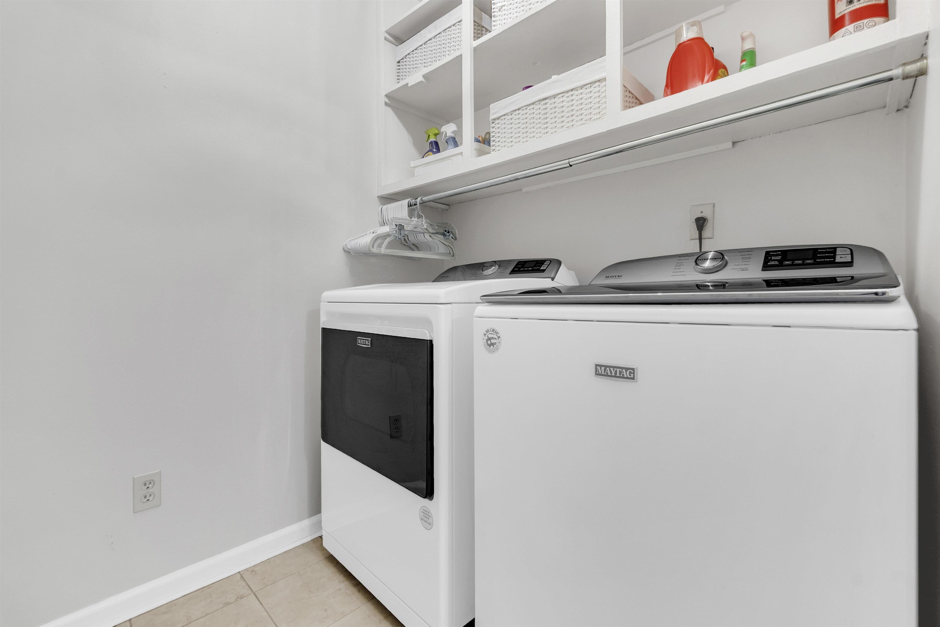 7255 Barnstable Road Memphis, TN 38125 - Photo 23 of 27 Washroom with independent washer and dryer, light tile patterned flooring, and baseboards