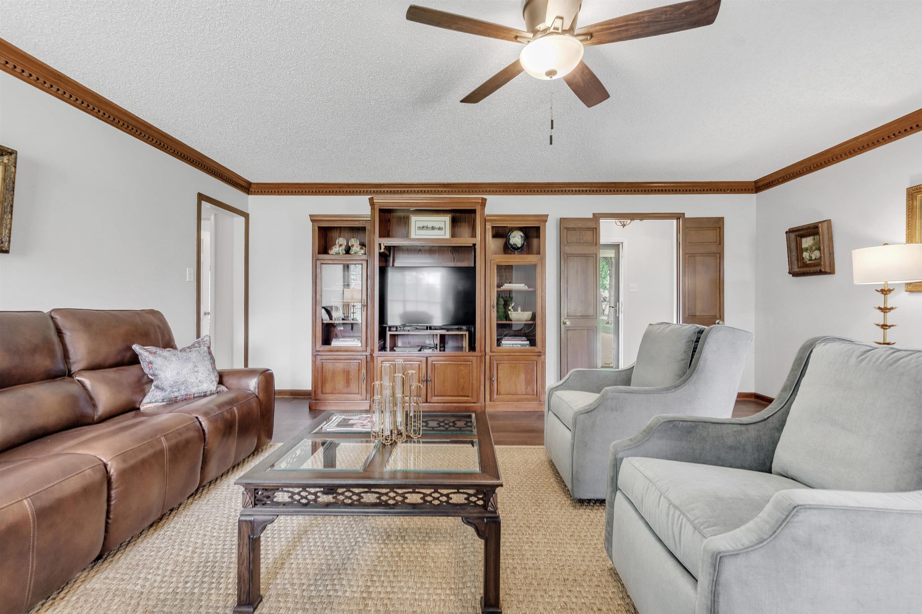 7255 Barnstable Road Memphis, TN 38125 - Photo 7 of 27 Living area featuring ceiling fan and ornamental molding