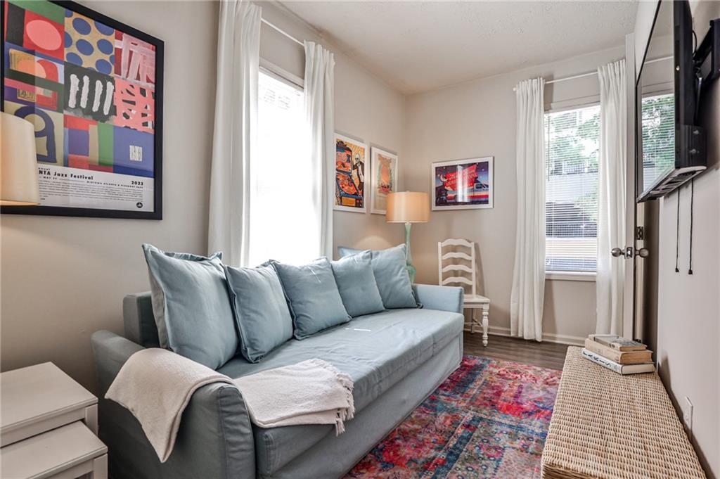 a living room with furniture and a rug