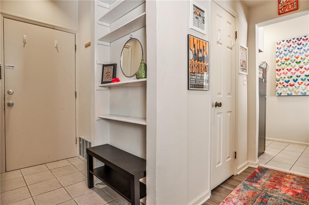 1100 Piedmont Avenue Northeast, Unit 6 Atlanta, GA 30309 - Photo 2 of 16 a room with painting and a table