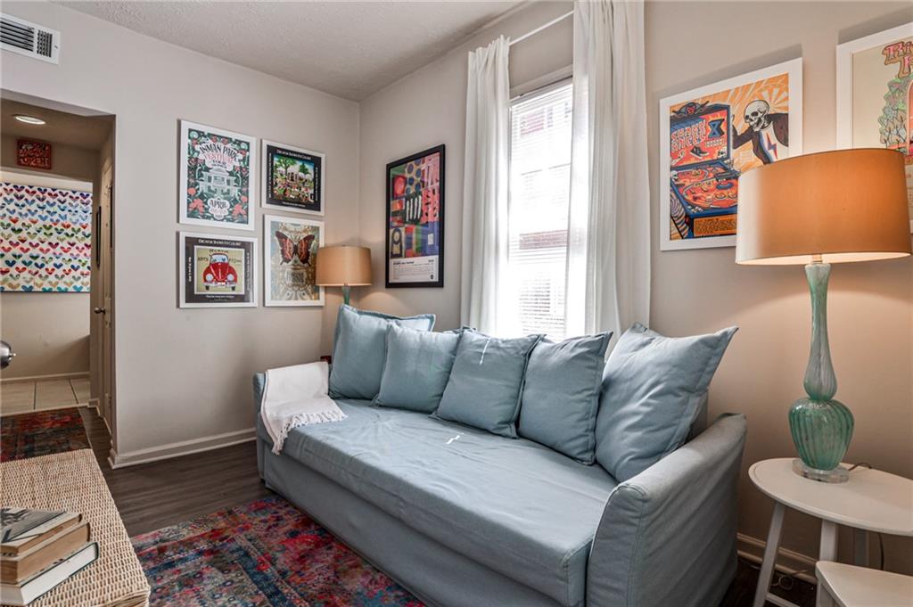 1100 Piedmont Avenue Northeast, Unit 6 Atlanta, GA 30309 - Photo 3 of 16 a living room with furniture and a window