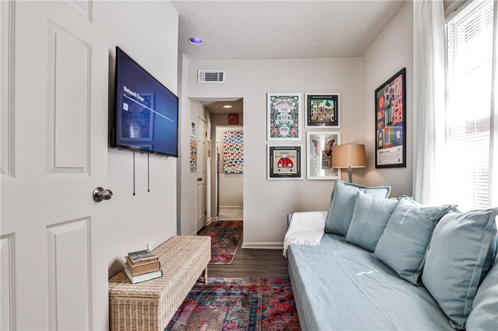 1100 Piedmont Avenue Northeast, Unit 6 Atlanta, GA 30309 - Photo 4 of 16 a living room with furniture and a rug
