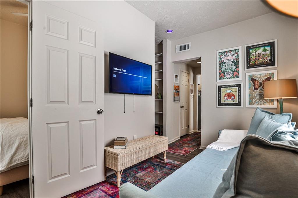 1100 Piedmont Avenue Northeast, Unit 6 Atlanta, GA 30309 - Photo 5 of 16 a living room with furniture and a wooden floor