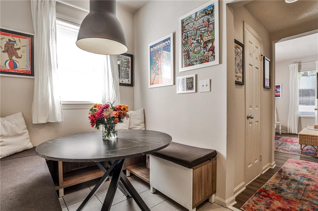 1100 Piedmont Avenue Northeast, Unit 6 Atlanta, GA 30309 - Photo 9 of 16 a view of a dining room with furniture and a potted plant