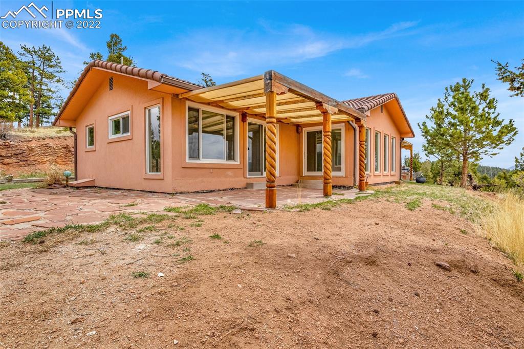 1500 Hitchrack Road Bailey, CO 80421 - Photo 1 of 43 a view of a house with wooden fence