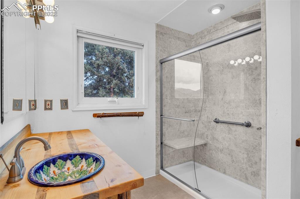 1500 Hitchrack Road Bailey, CO 80421 - Photo 11 of 43 a bathroom with a tub and a window