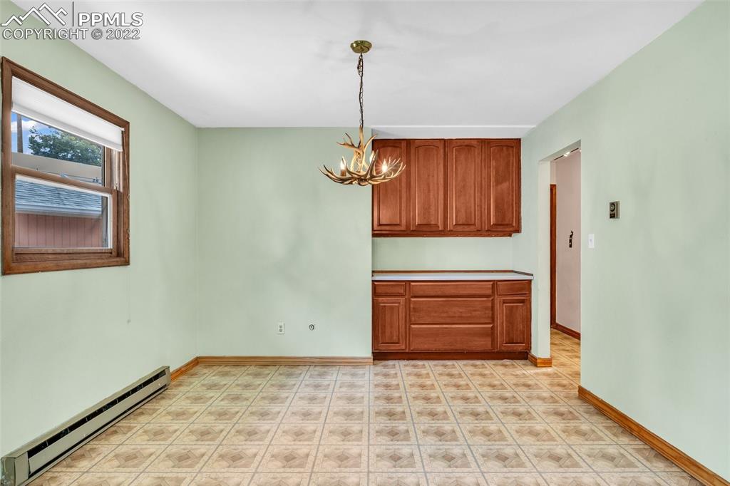 1500 Hitchrack Road Bailey, CO 80421 - Photo 16 of 43 a view of empty room with wooden floor and window