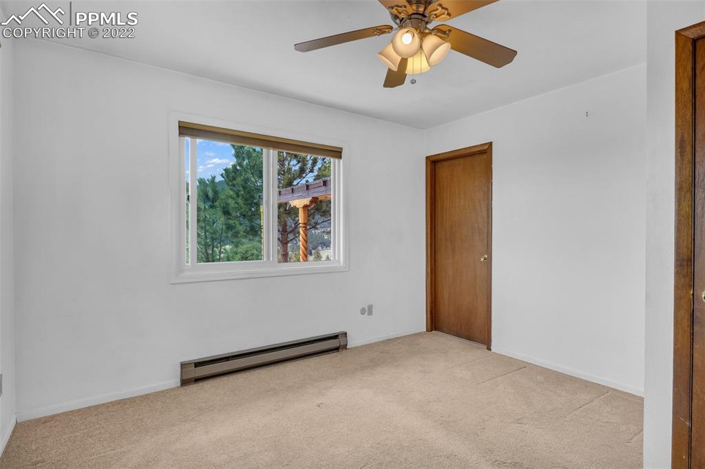 1500 Hitchrack Road Bailey, CO 80421 - Photo 21 of 43 an empty room with a window and a fan