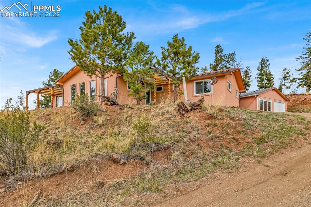 1500 Hitchrack Road Bailey, CO 80421 - Photo 32 of 43 a front view of a house with a yard
