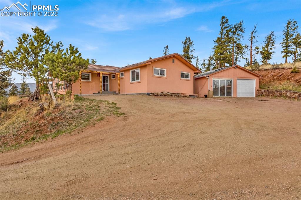 1500 Hitchrack Road Bailey, CO 80421 - Photo 38 of 43 a front view of a house with a yard