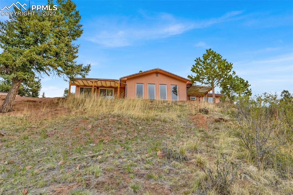 1500 Hitchrack Road Bailey, CO 80421 - Photo 40 of 43 a backyard of a house with lots of green space