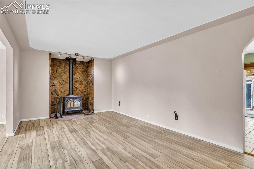 1500 Hitchrack Road Bailey, CO 80421 - Photo 4 of 43 wooden floor in an empty room with a window