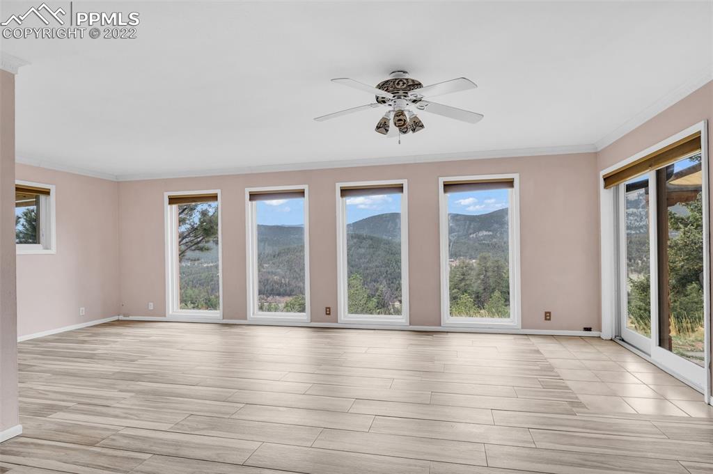 1500 Hitchrack Road Bailey, CO 80421 - Photo 6 of 43 a view of an room with wooden floor and fan