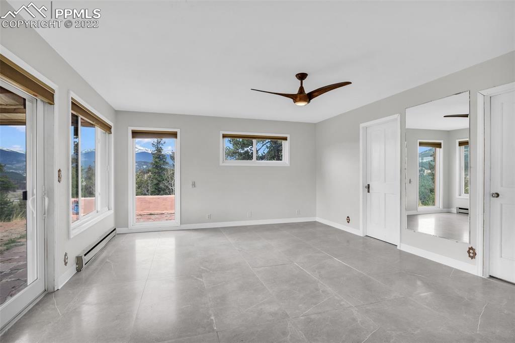 1500 Hitchrack Road Bailey, CO 80421 - Photo 8 of 43 a view of an empty room with glass door
