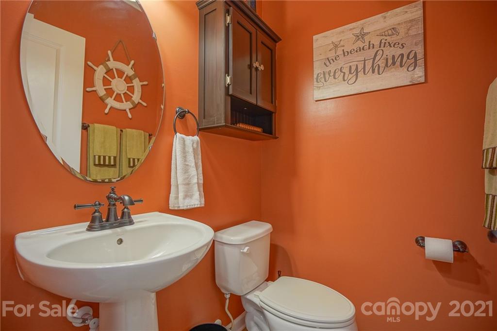7788 East Berkeley Road, Unit 1106 Denver, NC 28037 - Photo 11 of 48 a bathroom with a sink and a mirror