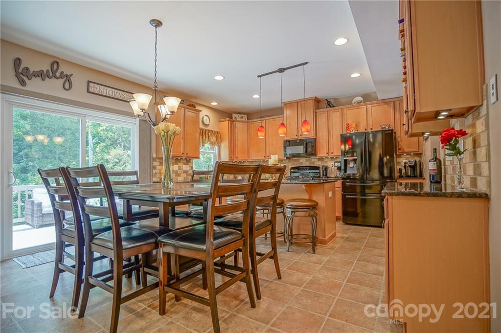 7788 East Berkeley Road, Unit 1106 Denver, NC 28037 - Photo 12 of 48 a view of a dining room with furniture window and outside view