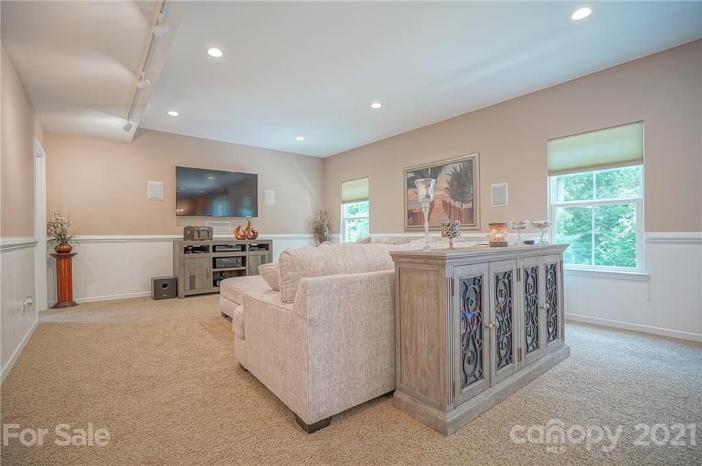 7788 East Berkeley Road, Unit 1106 Denver, NC 28037 - Photo 18 of 48 a kitchen with kitchen island granite countertop a sink counter top space appliances and a window