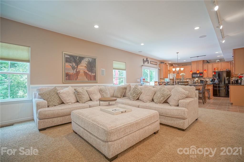 7788 East Berkeley Road, Unit 1106 Denver, NC 28037 - Photo 20 of 48 a living room with furniture and a view of kitchen